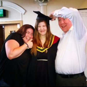 My graduation with my nutcase of a sister and brother in law!